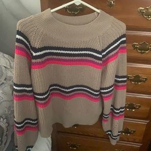 tan sweater with colorful stripes